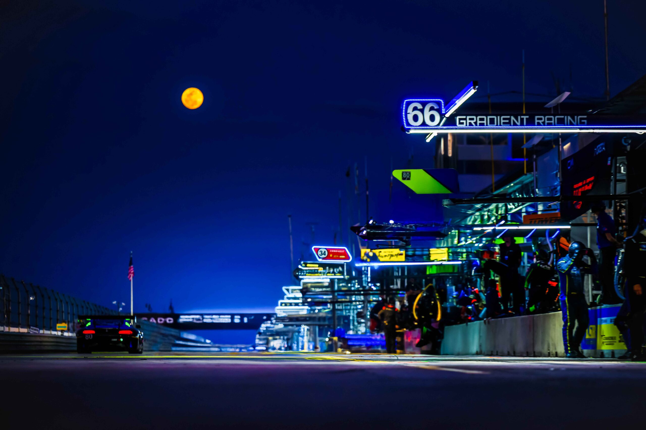 Nighttime view of pit road at racetrack